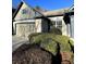 Exterior shot of home with stone and siding, a garage, lush landscaping, and a well-maintained lawn at 1315 Thunder Gulch Pass, Suwanee, GA 30024