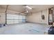 Spacious garage featuring an automatic door and plenty of room for storage at 1315 Thunder Gulch Pass, Suwanee, GA 30024