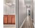 Hallway with wood flooring leading to bathroom at 1315 Thunder Gulch Pass, Suwanee, GA 30024