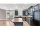 Spacious kitchen with island, stainless steel appliances, and custom cabinetry at 1315 Thunder Gulch Pass, Suwanee, GA 30024