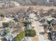 Scenic aerial view of a quiet residential neighborhood with lush greenery and access to a tranquil lake at 1574 Stepstone Way, Lawrenceville, GA 30043