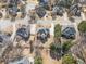 Lovely aerial perspective of an upscale residential area boasting neatly maintained properties and tree-lined streets at 1574 Stepstone Way, Lawrenceville, GA 30043