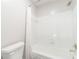 Classic bathroom with a white tub, shower combination with a white curtain, and a toilet at 1574 Stepstone Way, Lawrenceville, GA 30043