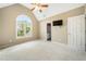 Large bedroom featuring vaulted ceilings, a ceiling fan, a large window and a television at 1574 Stepstone Way, Lawrenceville, GA 30043