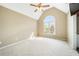 Spacious bedroom with vaulted ceilings, neutral walls, large window and a ceiling fan at 1574 Stepstone Way, Lawrenceville, GA 30043