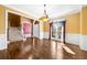 Bright and airy dining room with hardwood floors and traditional light fixture at 1574 Stepstone Way, Lawrenceville, GA 30043