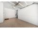 Clean, well-lit garage with epoxy flooring and plenty of space for parking and storage at 1574 Stepstone Way, Lawrenceville, GA 30043