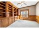 Bright office featuring custom wood shelving and trim throughout at 1574 Stepstone Way, Lawrenceville, GA 30043
