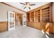 Open office with custom wood shelving and trim throughout at 1574 Stepstone Way, Lawrenceville, GA 30043