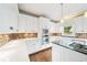 Bright kitchen featuring updated countertops, stainless steel appliances, and plenty of natural light at 1574 Stepstone Way, Lawrenceville, GA 30043