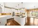 Bright kitchen with white cabinets, granite countertops, and stainless steel appliances, perfect for cooking and entertaining at 1574 Stepstone Way, Lawrenceville, GA 30043