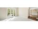 Bright room with carpeted floors and a large window offering natural light at 1574 Stepstone Way, Lawrenceville, GA 30043