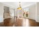 Spacious living room with wood floors, staircase, and large window at 1574 Stepstone Way, Lawrenceville, GA 30043