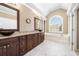 Bright main bathroom featuring double vanity sinks and soaking tub at 1574 Stepstone Way, Lawrenceville, GA 30043