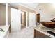 Main bathroom features double vanity sinks and soaking tub with column at 1574 Stepstone Way, Lawrenceville, GA 30043