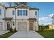 Charming townhome with a brick facade, attached garage, and well-manicured front yard at 2270 Jamin Bnd # 12, Lithonia, GA 30058