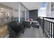 Relaxing balcony space with outdoor seating and partial view of building's exterior at 620 Peachtree Ne St # 503, Atlanta, GA 30308