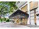 An inviting building entrance with a stylish black awning and prominent street address at 620 Peachtree Street at 620 Peachtree Ne St # 503, Atlanta, GA 30308