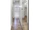 Hallway with tile and wood floors, leading to the bathroom and closet spaces at 620 Peachtree Ne St # 503, Atlanta, GA 30308