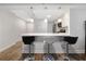 An inviting kitchen bar with sleek countertops, pendant lighting, and comfortable seating for casual dining at 620 Peachtree Ne St # 503, Atlanta, GA 30308