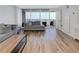 Spacious living room featuring hardwood floors and sliding doors leading to a private balcony, offering outdoor enjoyment at 620 Peachtree Ne St # 503, Atlanta, GA 30308