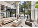 Modern lobby featuring comfortable seating, marble accents, and expansive windows offering views of the surrounding cityscape at 620 Peachtree Ne St # 503, Atlanta, GA 30308