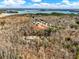 An aerial view of lakefront community of luxurious homes with mature trees in a desirable lakeside location at 6744 Pass Road, Buford, GA 30518