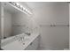 Bathroom with a bright vanity and large mirror and neutral wall color at 1735 Peachtree Ne St # 227, Atlanta, GA 30309