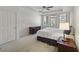 Bedroom featuring a ceiling fan, bedside table, and a door that leads to a balcony at 1735 Peachtree Ne St # 227, Atlanta, GA 30309