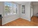 Bright breakfast nook featuring hardwood floors, large windows, and white trim at 1735 Peachtree Ne St # 227, Atlanta, GA 30309