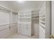 Walk-in closet features custom shelving and ample storage space at 1735 Peachtree Ne St # 227, Atlanta, GA 30309