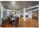 Another angle of dining room with a large table and hardwood floors throughout at 1735 Peachtree Ne St # 227, Atlanta, GA 30309