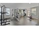 Well-equipped gym with a variety of exercise machines and natural light for a healthy lifestyle at 1735 Peachtree Ne St # 227, Atlanta, GA 30309