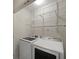 Modern laundry room with side-by-side washer and dryer at 1735 Peachtree Ne St # 227, Atlanta, GA 30309