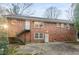 Brick two-story home with a metal stairway leading to a door on the second level at 2330 Bonnybrook Way, East Point, GA 30344