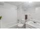 Traditional white bathroom with a shower-tub, a toilet, and a white vanity with a mirror at 2330 Bonnybrook Way, East Point, GA 30344