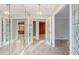 Bright foyer featuring mirrored walls, French doors, and tile flooring at 2330 Bonnybrook Way, East Point, GA 30344