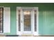 Elegant front door featuring decorative glass and green siding at 2330 Bonnybrook Way, East Point, GA 30344