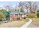 A single-story brick home with green shutters and a sidewalk leading to the front door at 2330 Bonnybrook Way, East Point, GA 30344