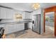 Bright kitchen with white cabinetry, stainless steel appliances, and granite countertops at 2330 Bonnybrook Way, East Point, GA 30344