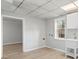 Well-lit laundry area boasts a white utility sink, cabinets, and light-toned flooring at 2330 Bonnybrook Way, East Point, GA 30344