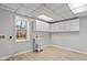 Laundry room with utility sink, storage, and new flooring at 2330 Bonnybrook Way, East Point, GA 30344