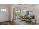 Bright dining room with coffered ceiling, stylish light fixture, and large window at 2396 Cadenza Cir, Dacula, GA 30019