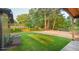 Expansive backyard with lush green lawn and mature trees, perfect for relaxation at 642 Austin Se Dr, Smyrna, GA 30082
