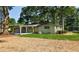 Expansive backyard featuring a covered patio and lush green lawn, ideal for outdoor relaxation at 642 Austin Se Dr, Smyrna, GA 30082