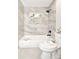 Bathroom with modern tub/shower featuring tiled walls and built-in shelving at 642 Austin Se Dr, Smyrna, GA 30082