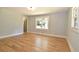 Spacious bedroom with hardwood flooring, painted trim, and bright windows at 642 Austin Se Dr, Smyrna, GA 30082