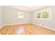 Inviting bedroom with hardwood floors, painted trim, and large windows at 642 Austin Se Dr, Smyrna, GA 30082