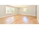 Empty bedroom with hardwood flooring, large windows, and painted trim at 642 Austin Se Dr, Smyrna, GA 30082