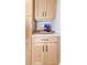Kitchen cabinets with quartz countertops and decorative drinkware at 642 Austin Se Dr, Smyrna, GA 30082